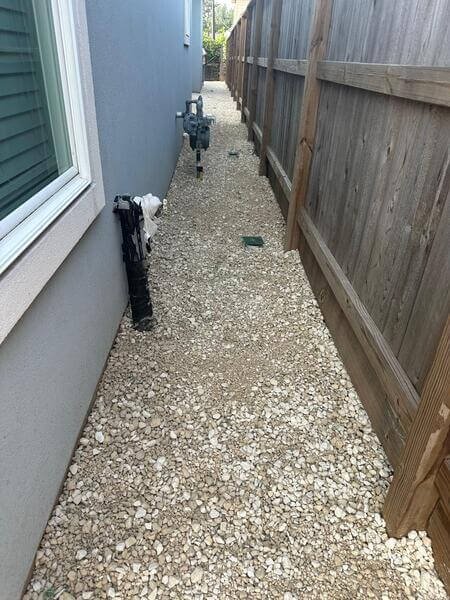 Gravel installation Richmond TX side yard landscaping
