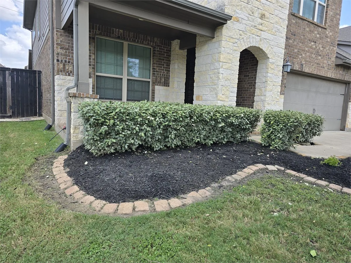 Side yard weed barrier and decorative rock installation